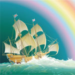 彩虹下在大海上航行的帆船