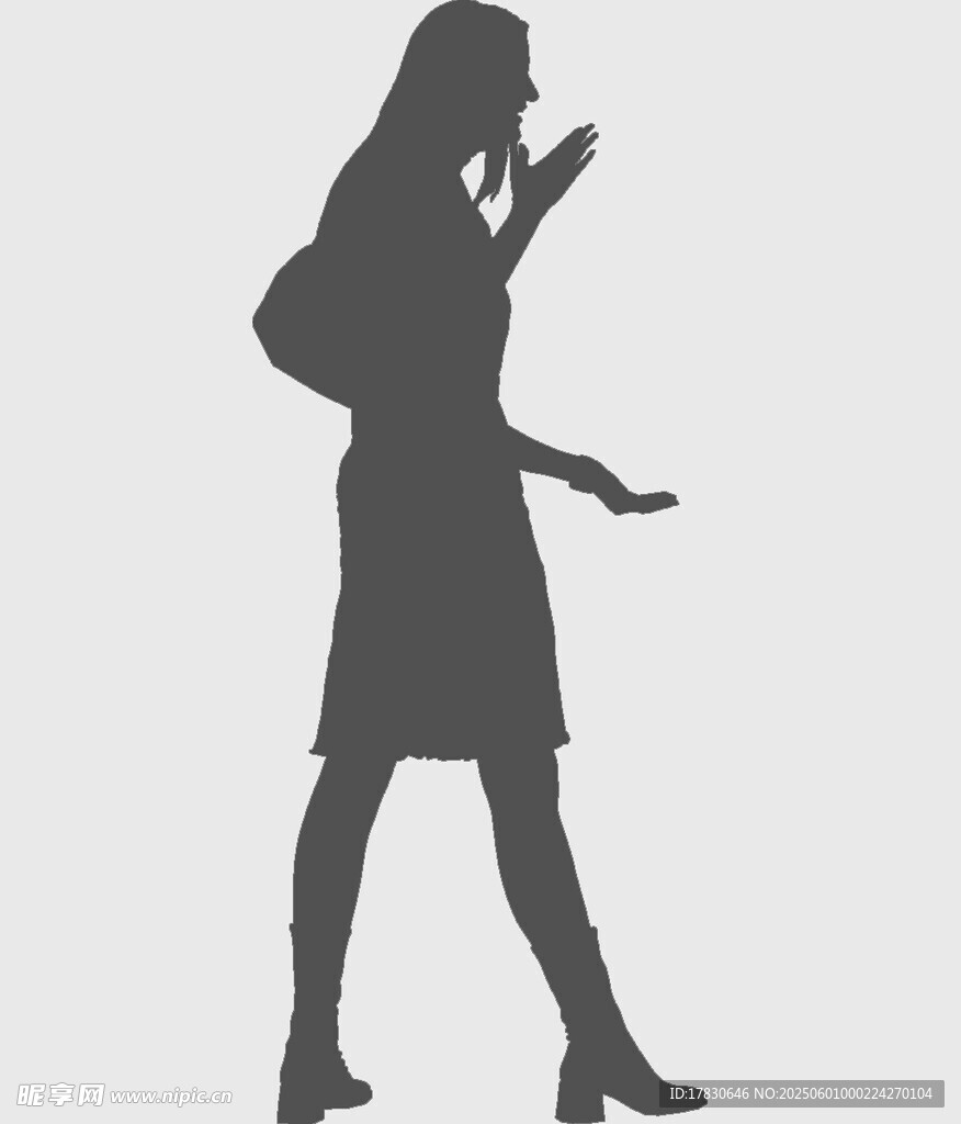 行走中打電話的女性剪影