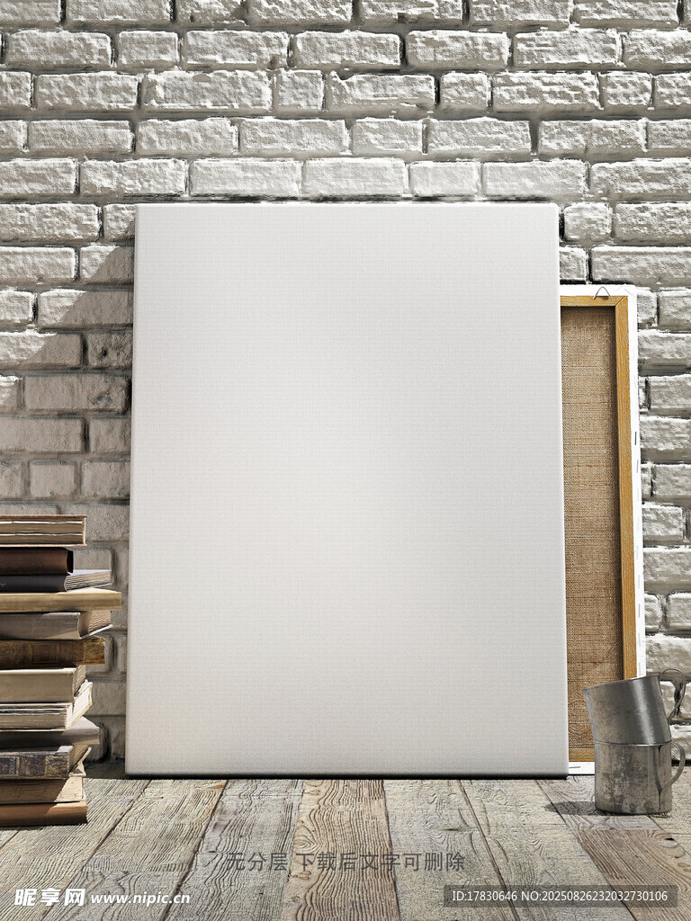 空白畫布與墻邊書籍?dāng)[件