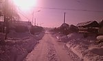 山村街道积雪摄影图片