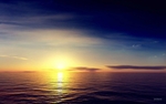 高清夕阳海面蓝天背景