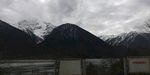 天空乌云雪山河谷风光