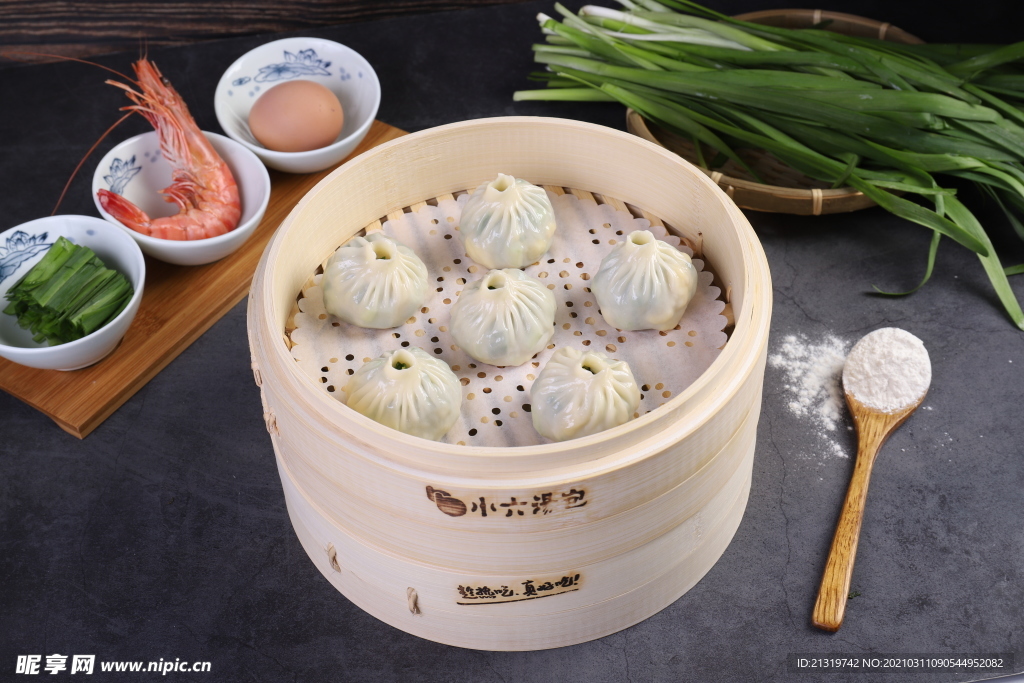 美食蒸包子摄影图