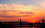 夕阳黄昏江畔大桥风光摄影 