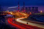 夜晚城市道路与化工厂