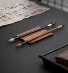 毛笔承实