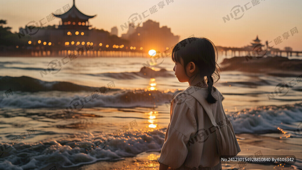 站在海边的小女孩欣赏海边日出