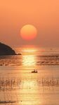 海上日落渔船美景
