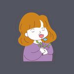 女孩捧花闭眼享受美好