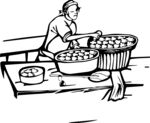 妇女桌边忙碌制作糕点