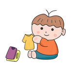 小男孩开心地摆弄衣物叠衣服学做
