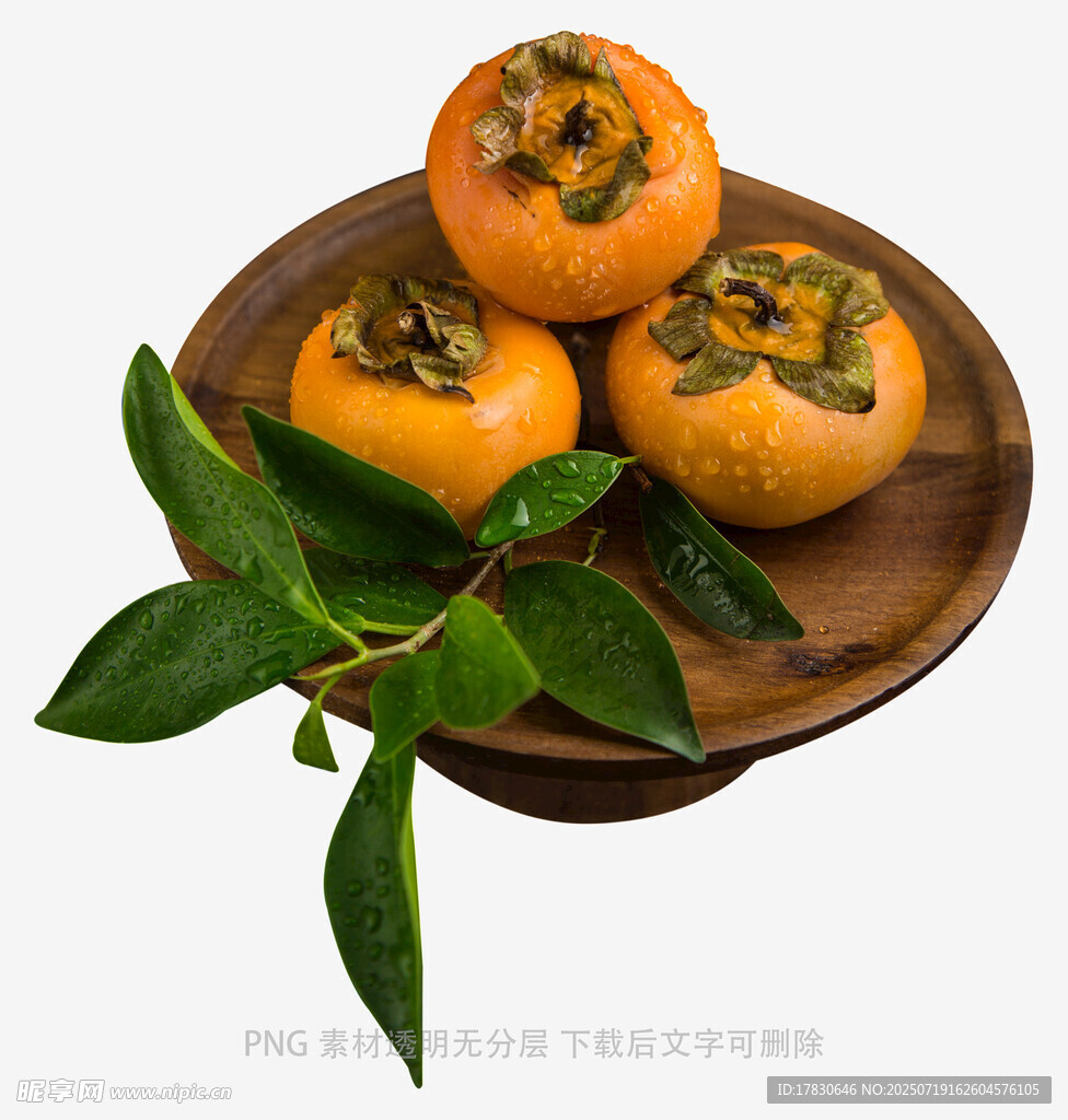 木盘上的新鲜柿子与绿叶