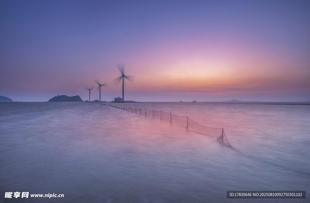 海边日暮风车美景