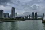 城市河畔高楼与阴沉天空