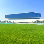 蓝白建筑旁的翠绿草地