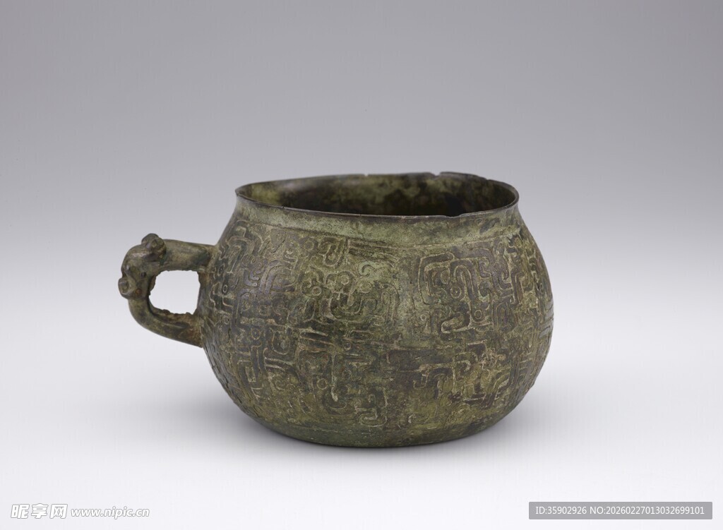 单柄青铜古容器