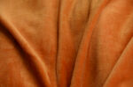 橙色柔软布料皮革纹理特写