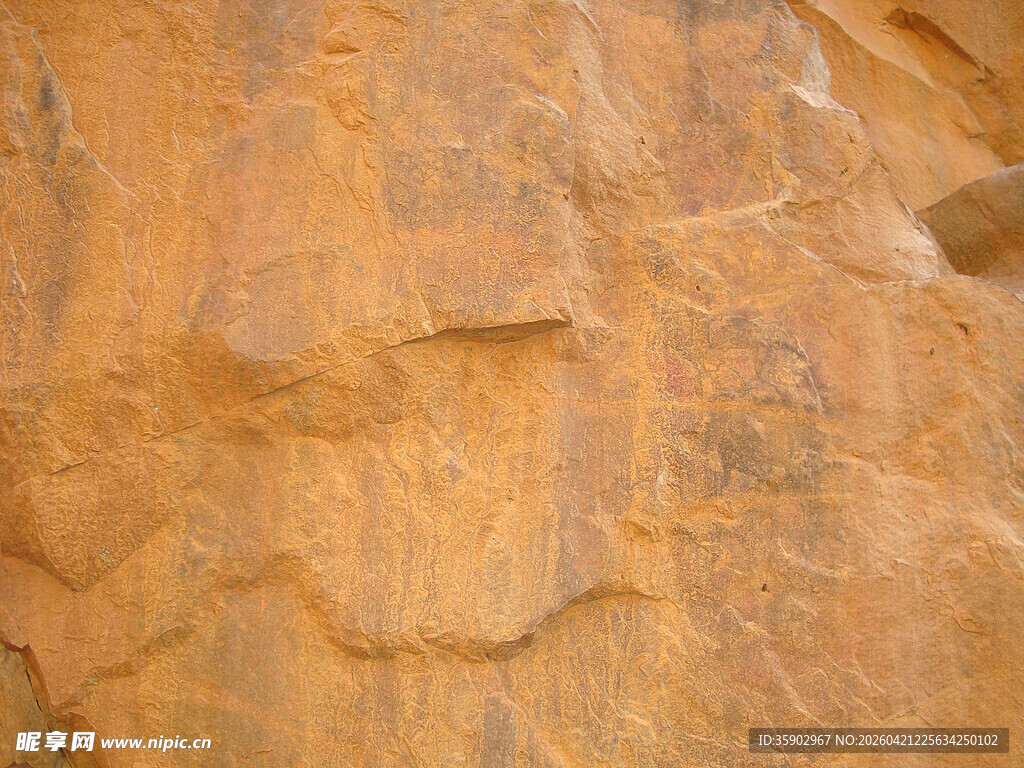 粗糙纹理的棕黄色岩石表面