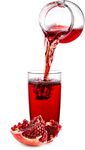 石榴汁正倒入玻璃杯