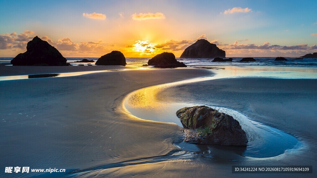 海边日落美景海浪绕石