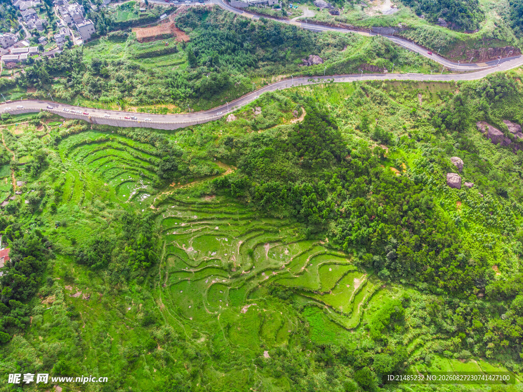 航拍山间蜿蜒翠绿公路