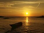 海面落日孤舟美景 红海湾
