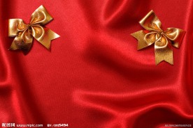 红色布与金色蝴蝶结高清图片