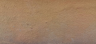 粗糙棕黄色真石漆墙面纹理