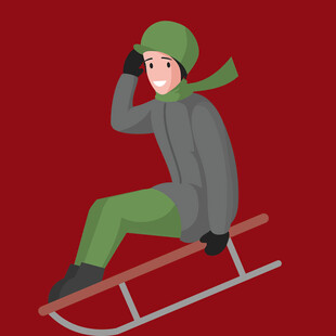 男孩坐雪橇享受冬日时光