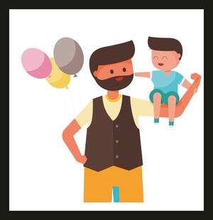 父亲抱孩子吹气球欢乐场景