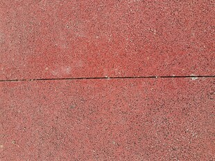 红色粗糙墙面纹理特写