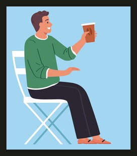 坐着喝咖啡的男子