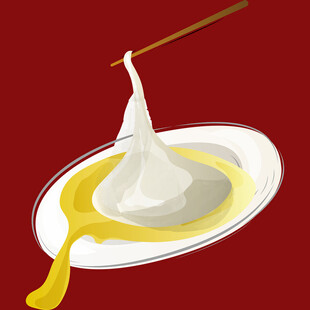 筷子夹起流心的白团子