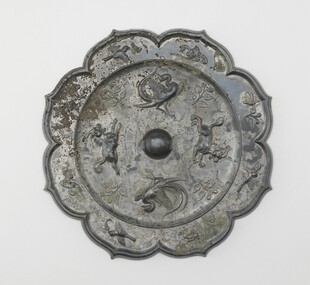 唐代花鸟纹菱花铜镜