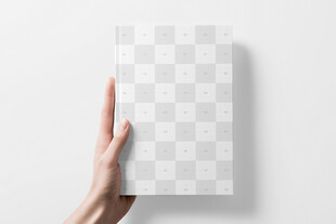 手持空白书籍展示样机 