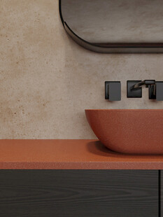 橙色洗手台搭配圆形镜子