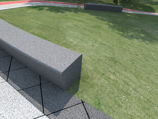 户外草坪旁的灰色长凳