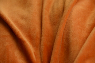 橙色柔软布料皮革纹理特写
