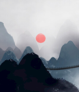 山间红日悬云雾绕峰峦