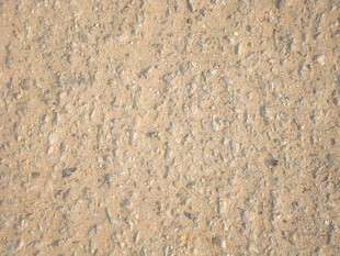 粗糙质感的棕黄色石材表面