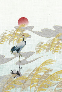 夕阳下双鹤栖于芦苇间