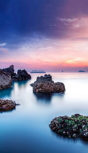 海边日落礁石美景