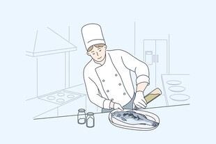 厨师专注处理盘中食材