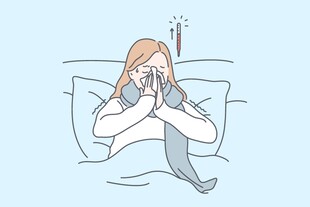 床上女子擤鼻涕显不适