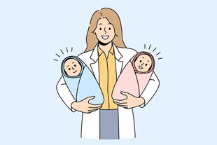 医生怀抱双胞新生儿