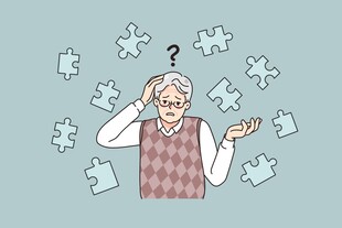 老人面对拼图一脸困惑