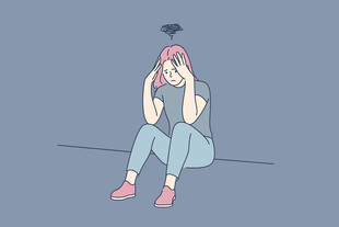 沮丧女孩独坐抱头