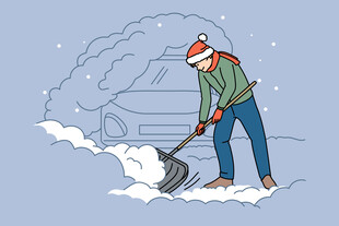 男子雪地中奋力铲雪
