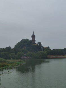 烟雨江畔古塔山景